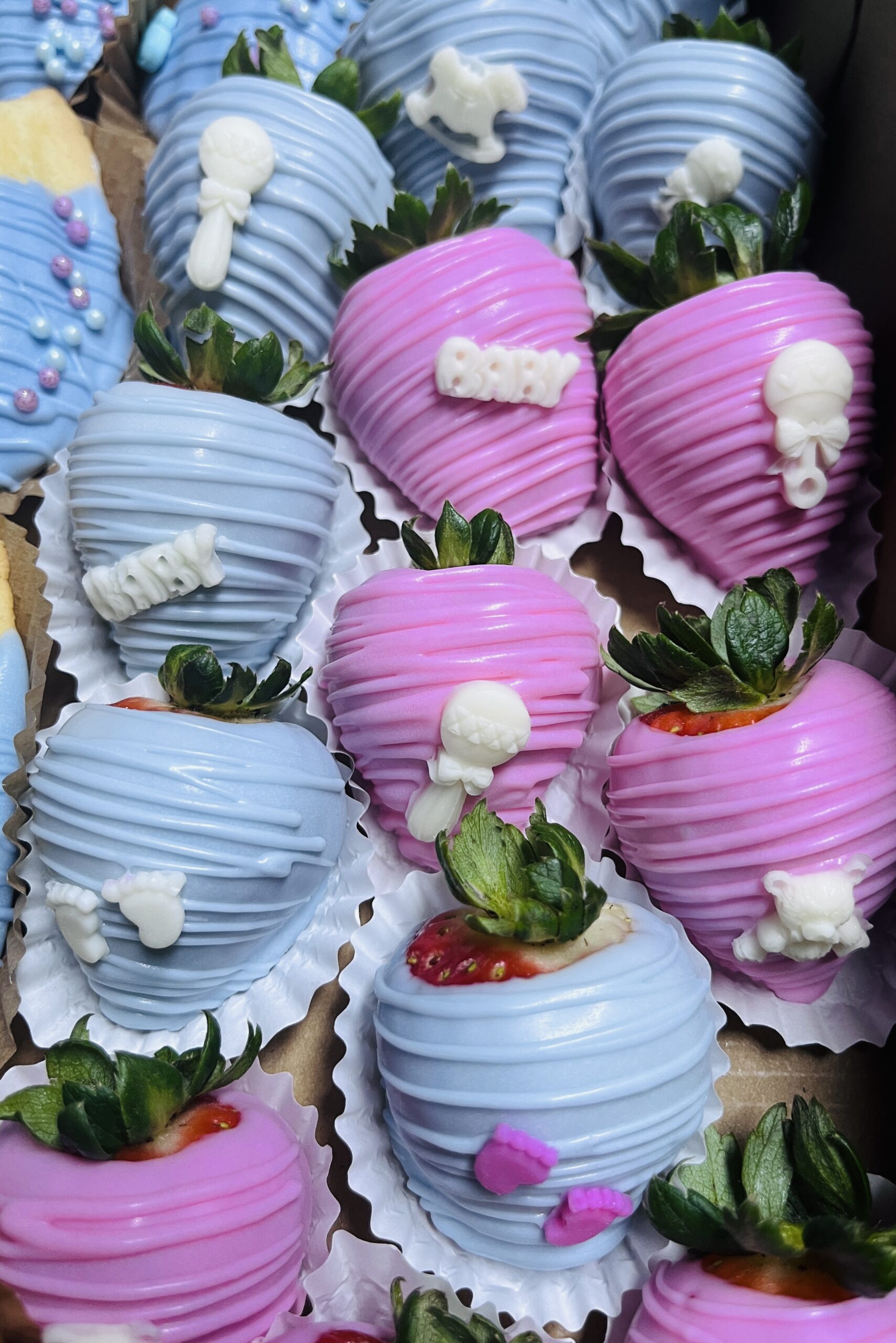 Decorated cupcakes with blue and pink frosting