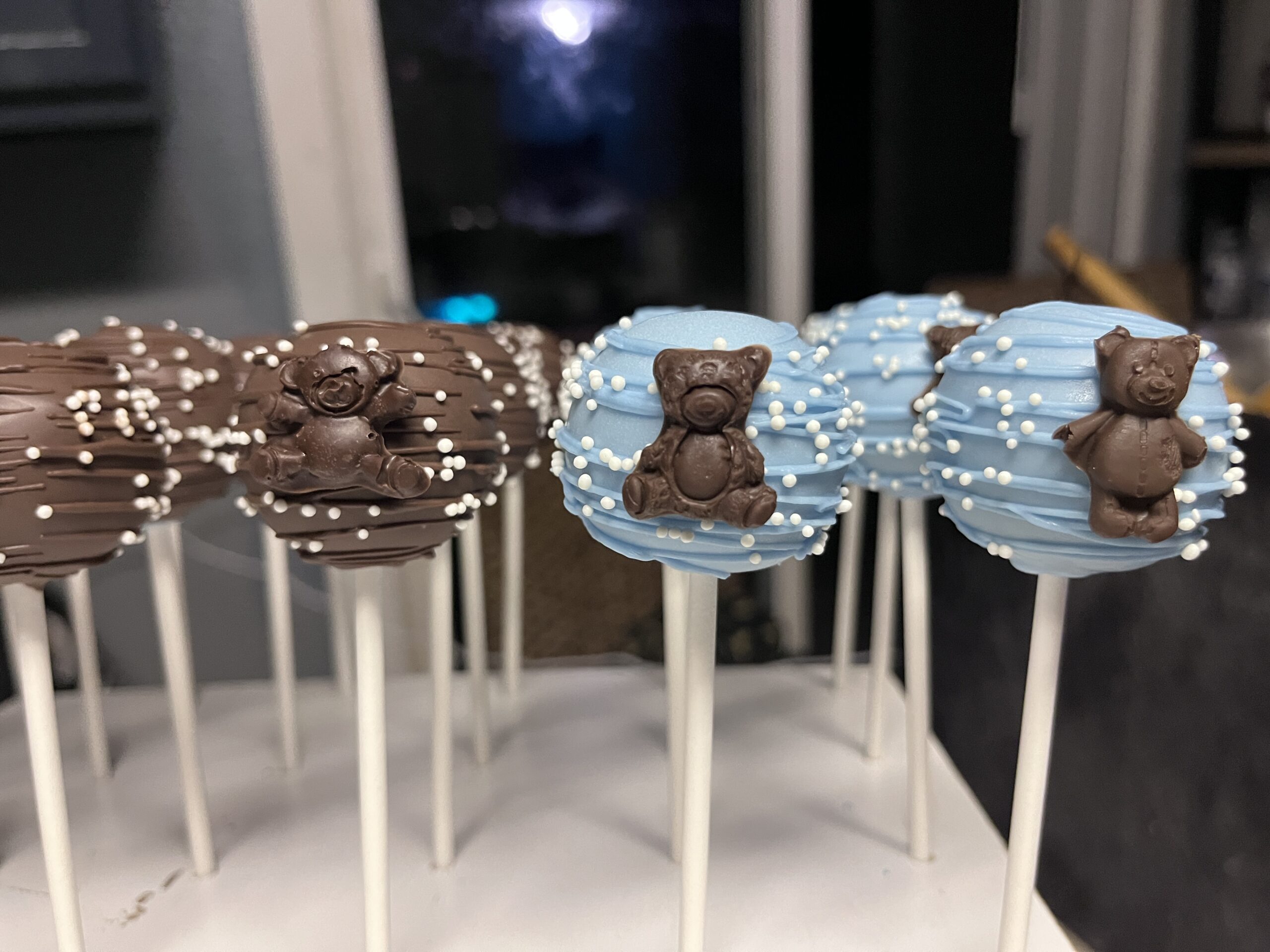 Chocolate and blue dessert treats on sticks